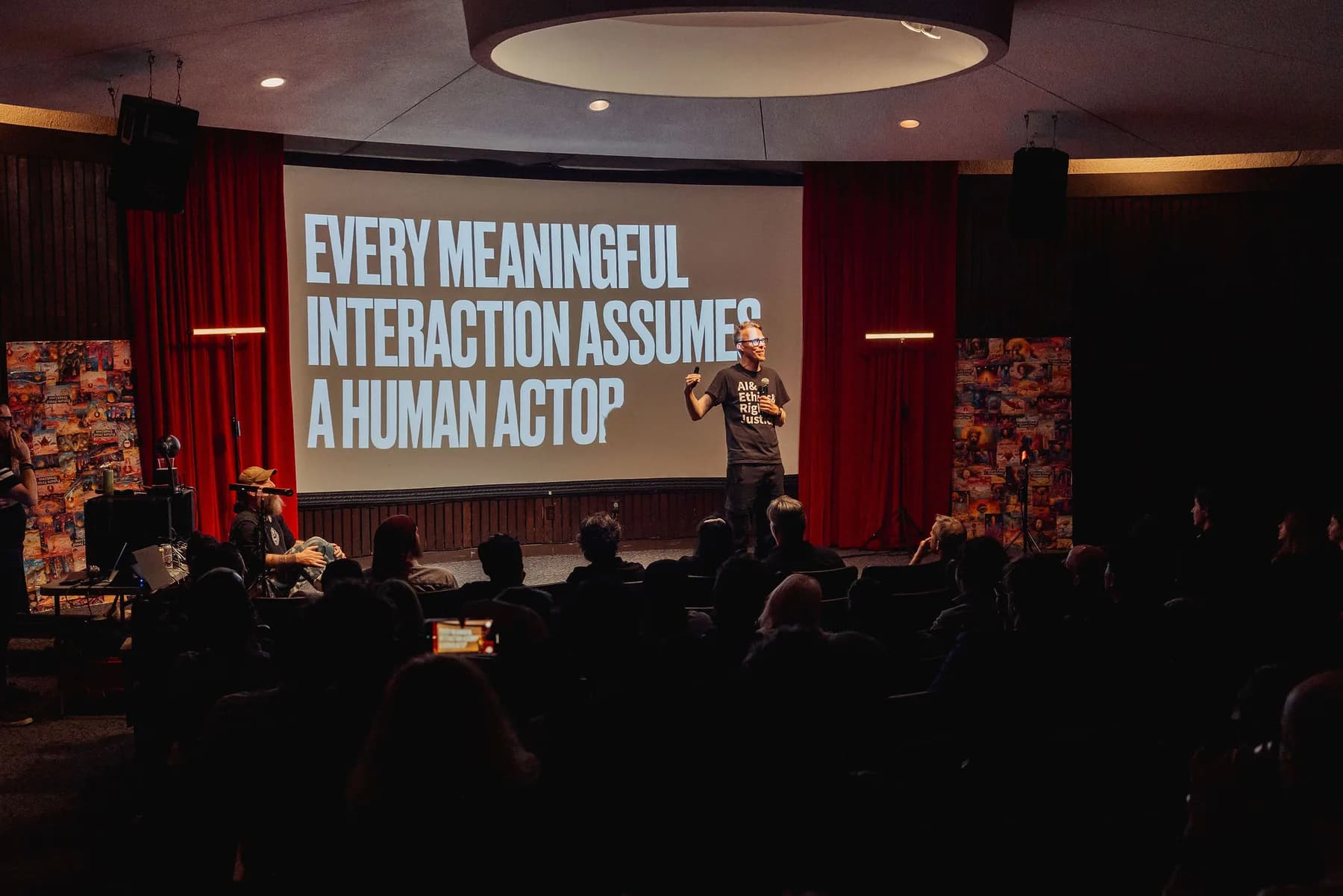 Auditorium talk with a slide about meaningful human interaction