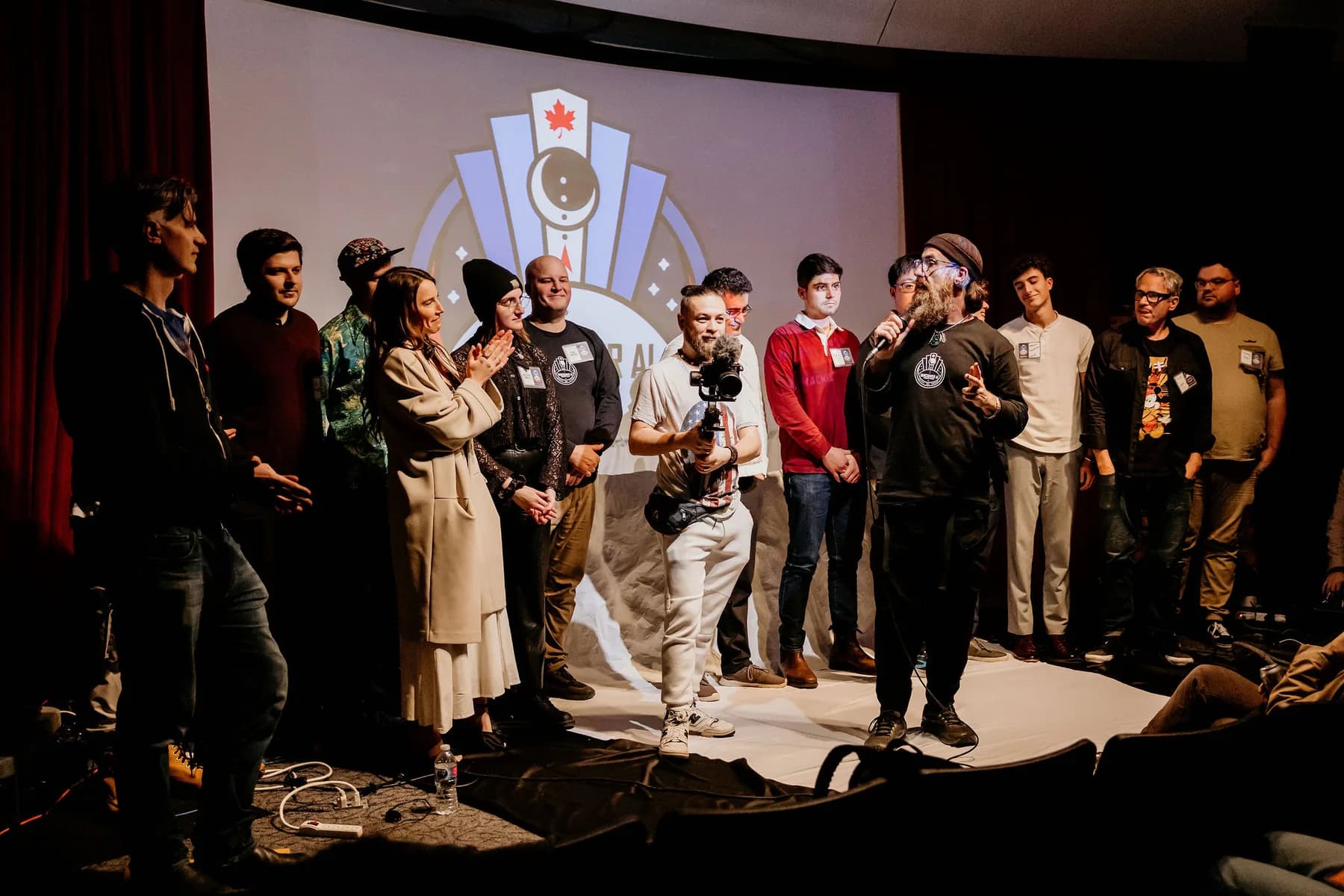 A large group of community members gathered on stage together after a Vancouver AI meetup
