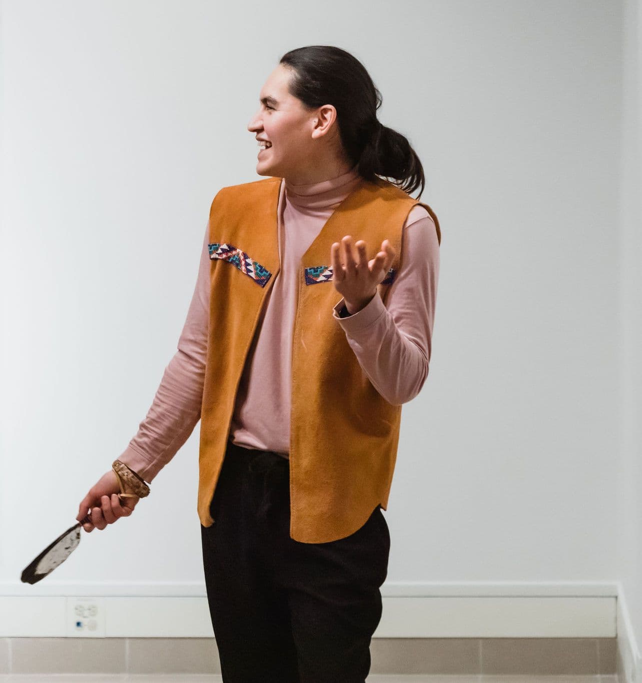 Manuel Axel Strain, wearing a tan vest and pink shirt, in the portrait published with their Vancouver AI meetup biography.