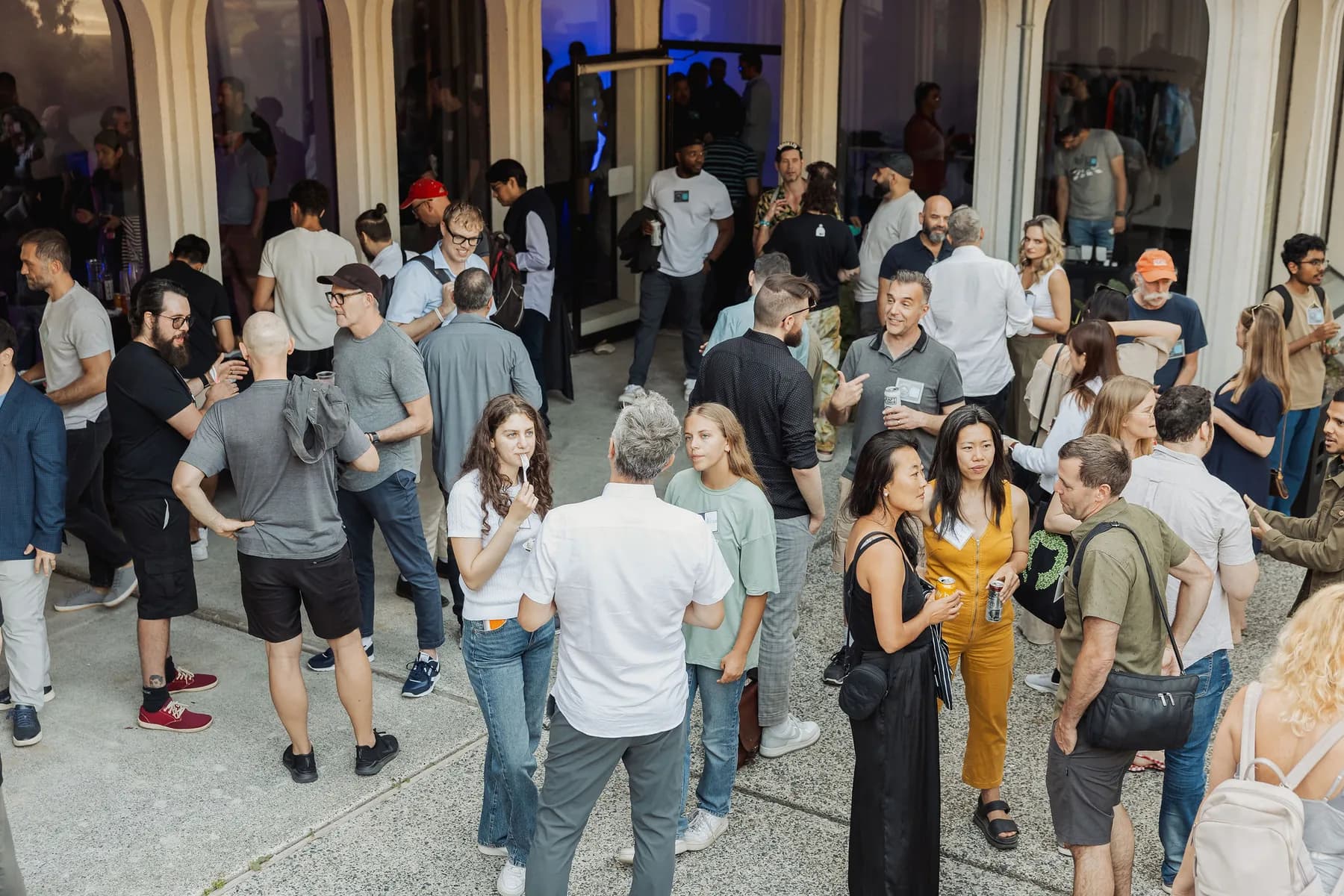 Outdoor courtyard mingling at a Vancouver AI Meetup