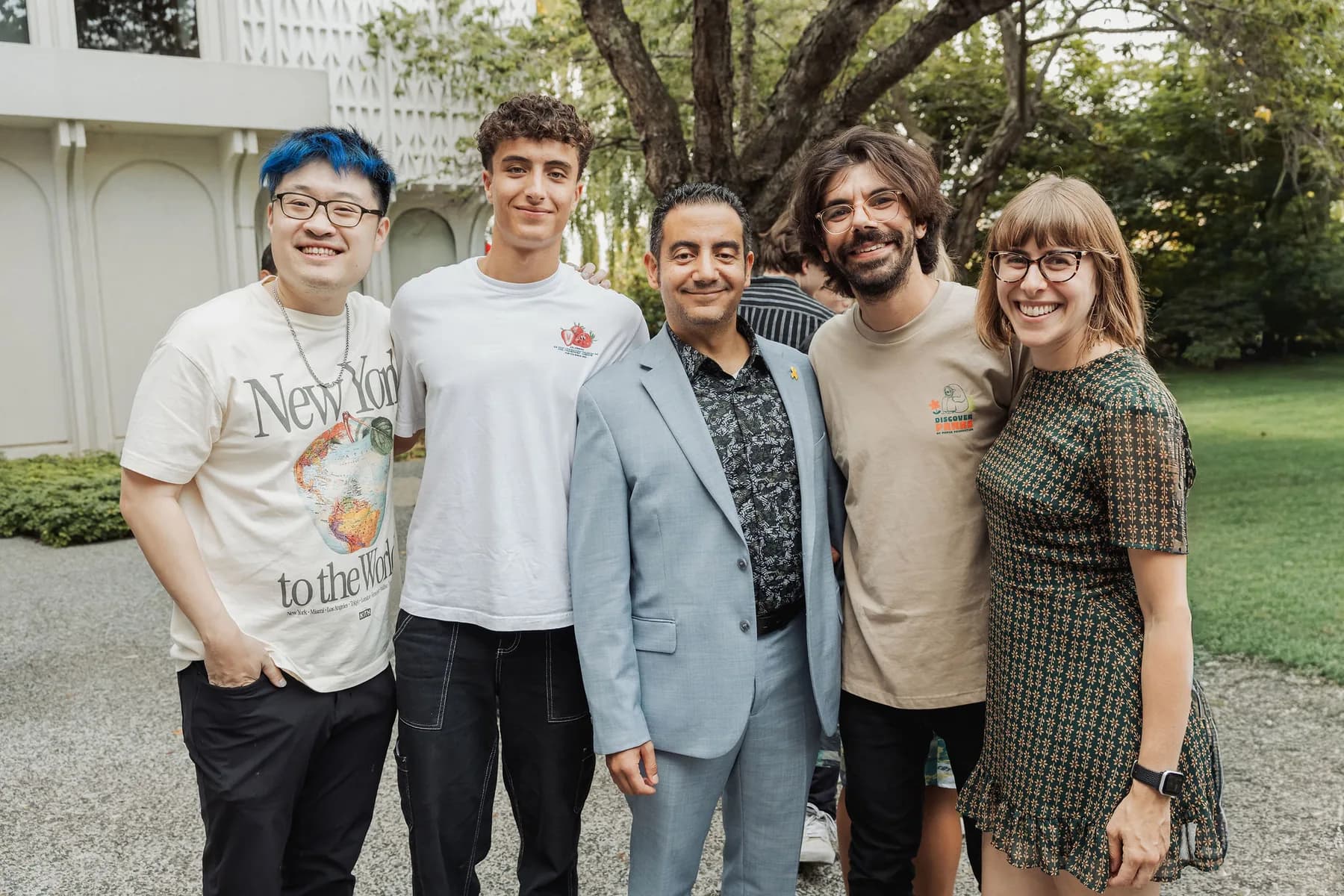 Five community members smiling together outdoors at a BC + AI Meetup