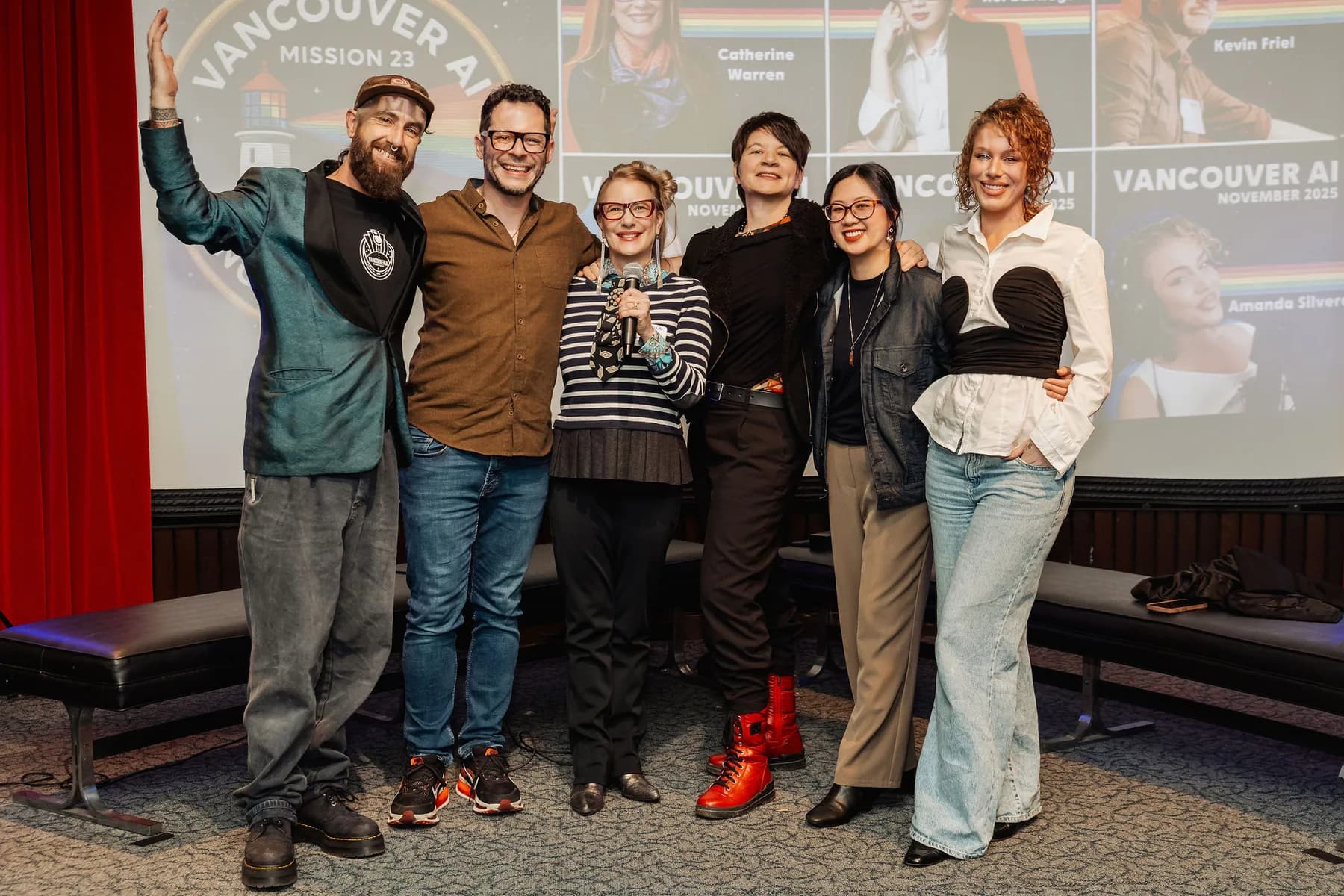Stage group portrait with a Vancouver AI screen