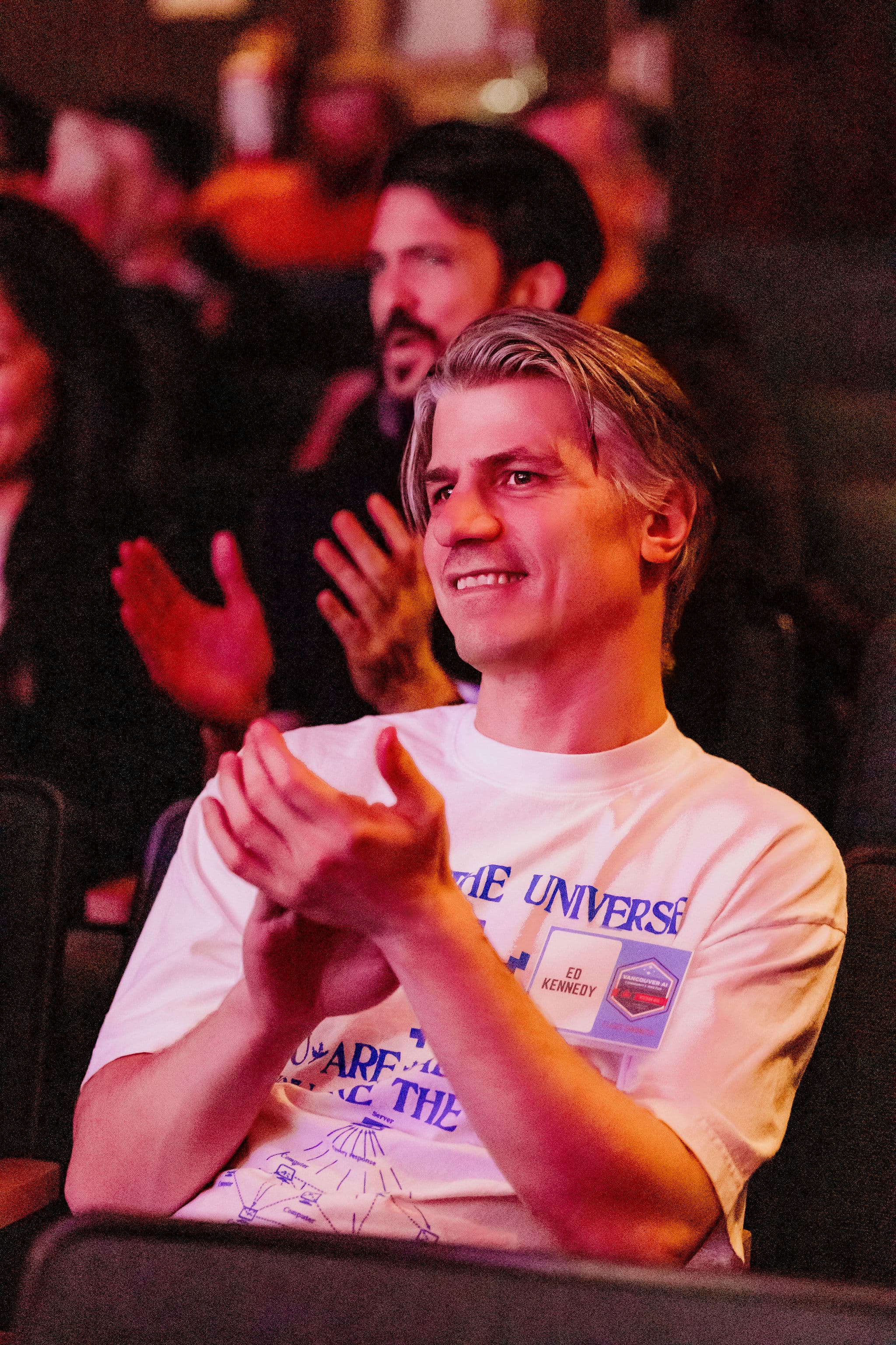 Audience member applauding at Vancouver AI Meetup